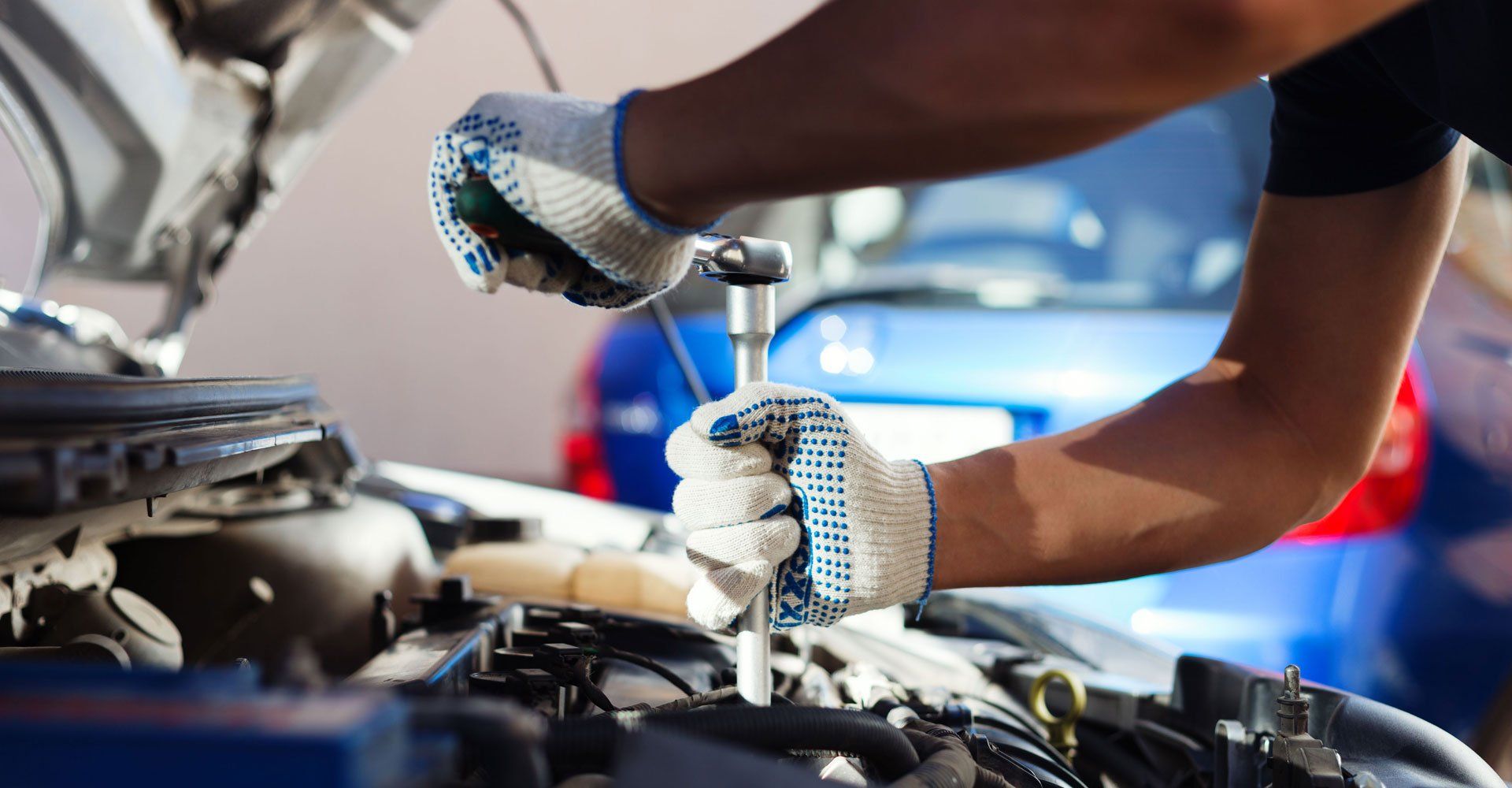 Auto tune-up, Mechanic working in auto repair garage